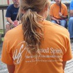 Olivia and the "Untamed Spirit" logo on her shirt