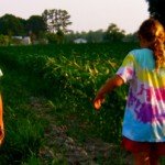 Shaun olivia and Rhys walking in the cornfield